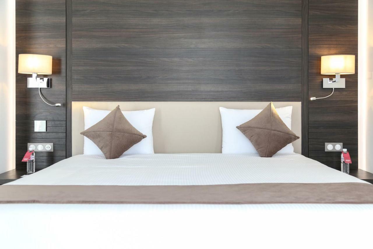 Radisson Hotel Sfax Exteriér fotografie A bed